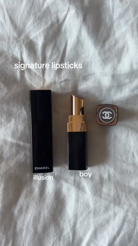 Two lipsticks and a compact on a white sheet, labeled